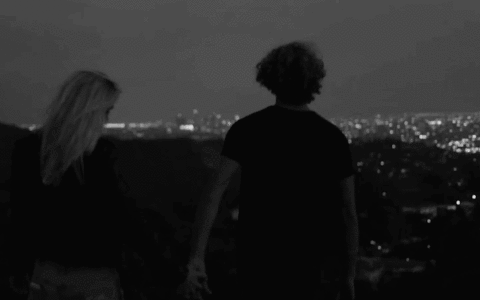 Romantic Couple Holding Hands GIF