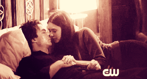 Romantic Couple Kissing In Bed GIF