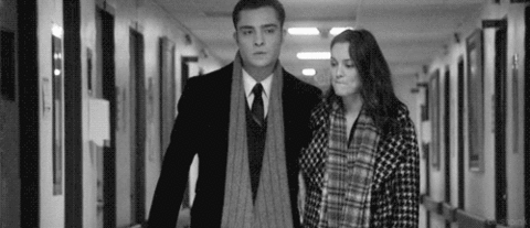 Couple Strolling Romantically Through Hallway GIF