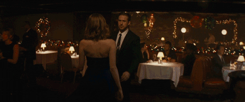 Romantic Gaze Across Restaurant GIF