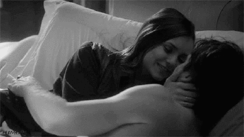 Romantic passionate kiss on bed gif