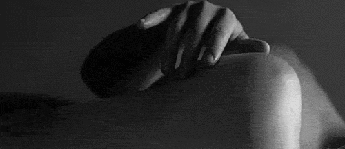 Running hand over shoulder while cuddling