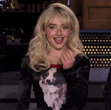 Sabrina Carpenter flirty wave gif