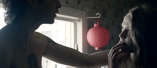Intimate Face Caress with Romantic Tension GIF