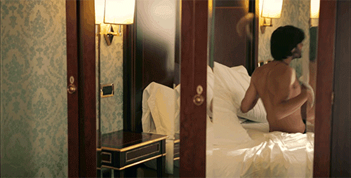 Sensual Man Brushing Hair Back GIF
