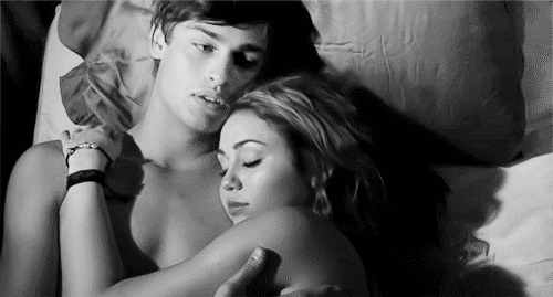 Sexy couple cuddling together in bed gif