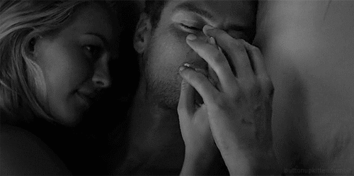 Sexy couple holding hands in bed gif