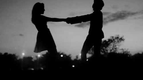 Spinning Couple Silhouette Kiss GIF