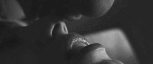 Soft Grayscale Kiss Shows Intimacy GIF
