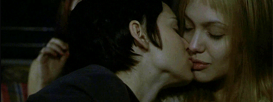 Two Women Share Affectionate Kiss GIF