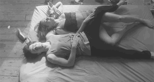 Woman rolls over to cuddle boyfriend gif